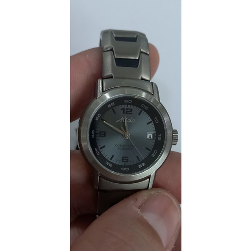 relógio mido ocean star dourado