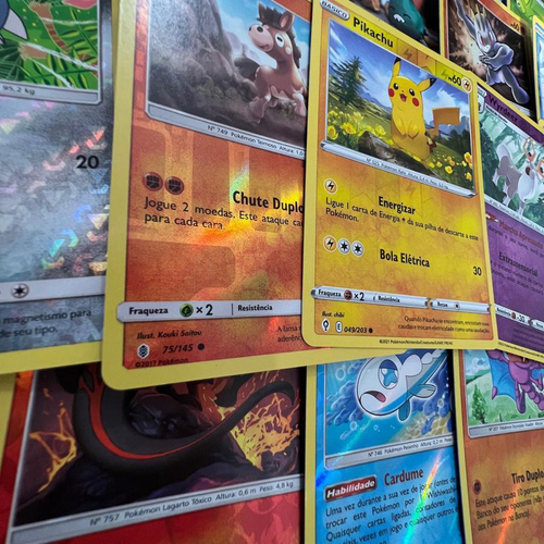 100 Cartas Pokemon Original Sem Repetições + brinde de 05 Cartas Brilhantes  em Promoção na Americanas